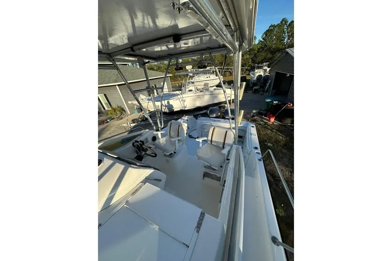 Slide: The Image of 2002 Century 2900 Walk-Around boat with spacious deck and seating area. - 8