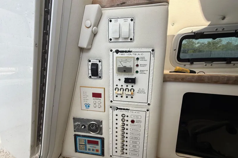 Slide: The Image of Electrical control panel on a 2002 Century 2900 Walk-Around boat interior. - 85