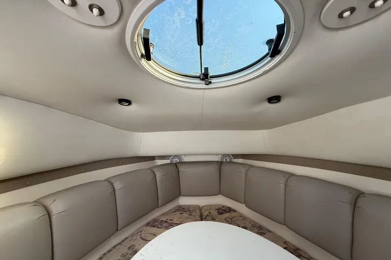 Slide: The Image of Interior cabin of 2002 Century 2900 Walk-Around boat with circular seating and skylight. - 91