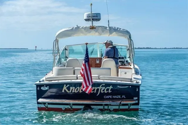 Slide: The Image of 2013 Hunt Yachts Harrier 25 boat named "Knot Perfect" on calm waters, Cape Haze, FL. - 5