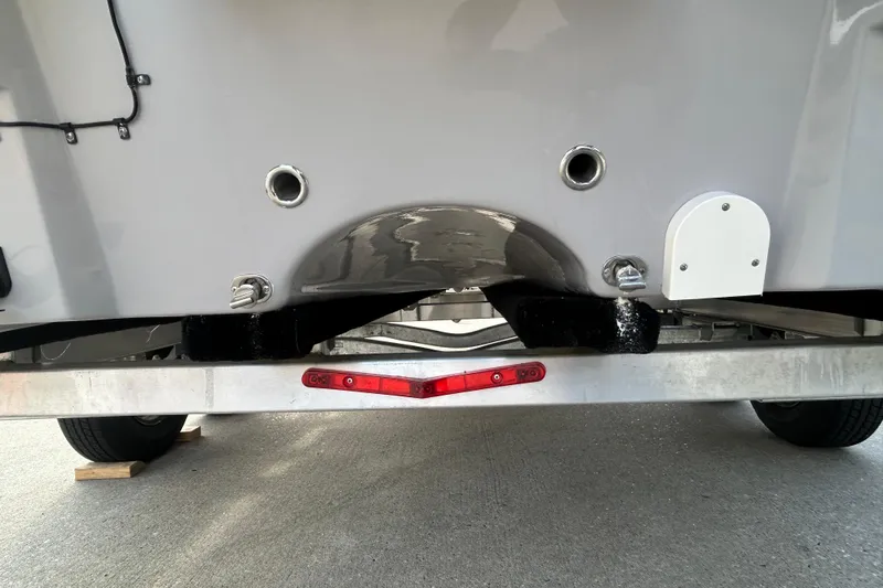 Slide: The Image of Sundance DX22 2026 boat trailer hitch and rear view, showcasing design details. - 10