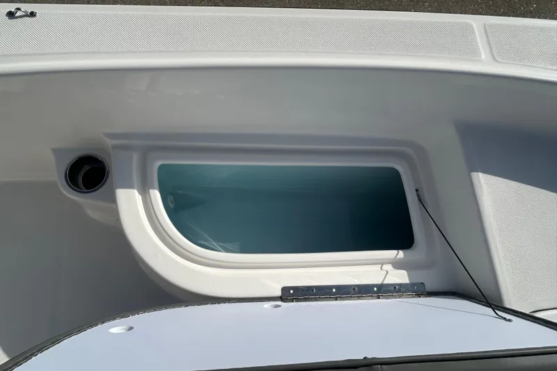 Slide: The Image of Livewell compartment on 2026 Sundance DX22 boat, featuring sleek design and functionality. - 14