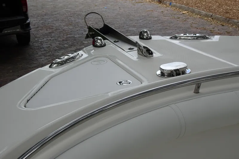 Slide: The Image of 2006 Edgewater 265CC boat deck with chrome fittings and anchor holder. - 12