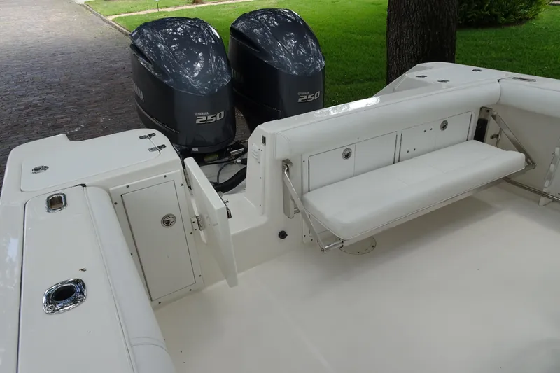 Slide: The Image of 2006 Edgewater 265CC boat with Yamaha 250 engines and white seating area. - 29