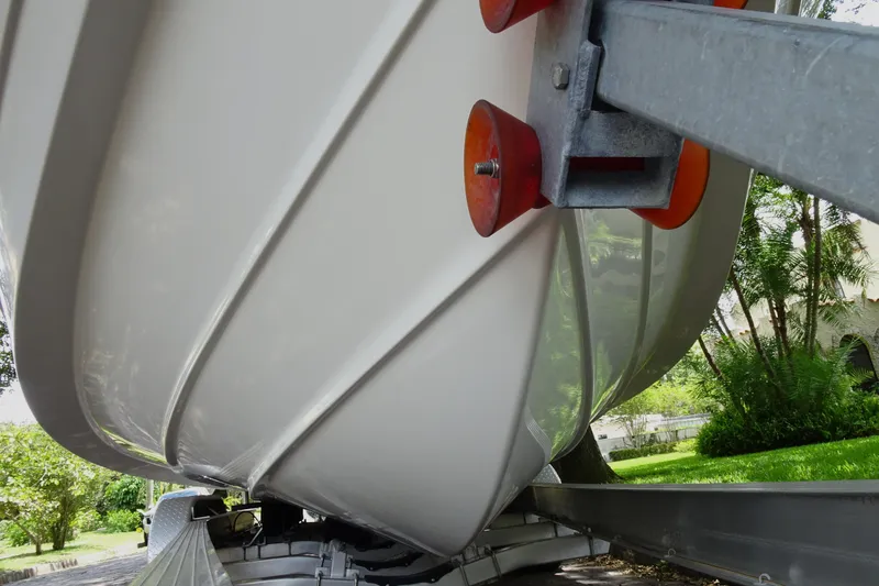 Slide: The Image of 2006 Edgewater 265CC boat hull on trailer, close-up view. - 6