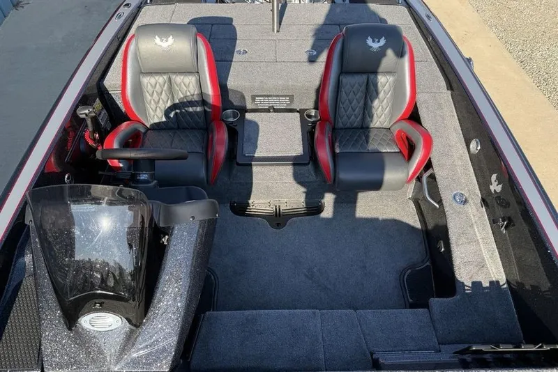 Slide: The Image of 2026 Phoenix 818 Pro boat interior with dual black and red seats, steering console. - 10
