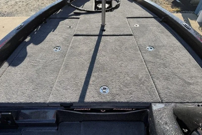 Slide: The Image of 2026 Phoenix 818 Pro boat deck with gray carpet and storage compartments. - 13