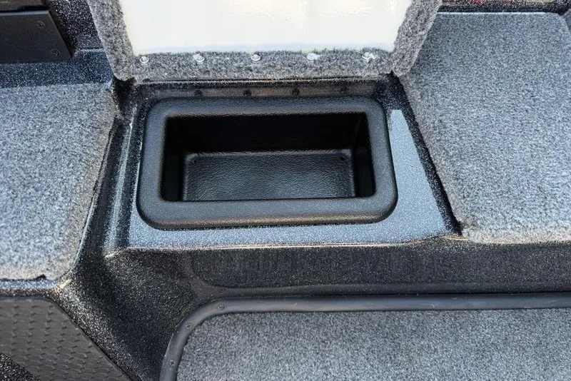 Slide: The Image of Storage compartment in 2026 Phoenix 818 Pro boat, featuring carpeted interior and durable design. - 16