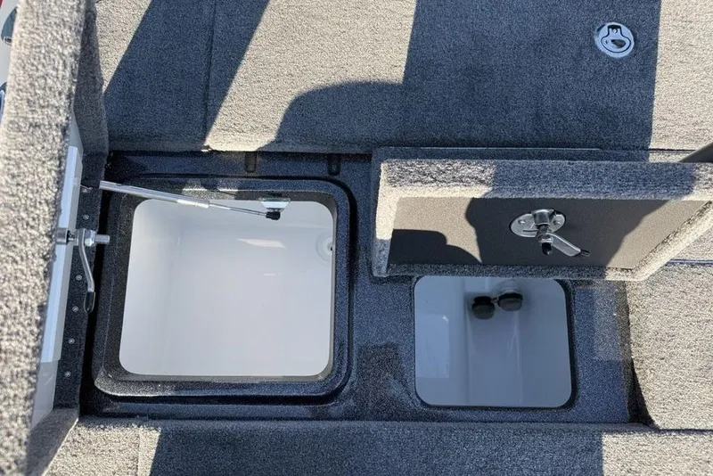 Slide: The Image of Open storage compartments on a 2026 Phoenix 818 Pro boat, showcasing interior design. - 28