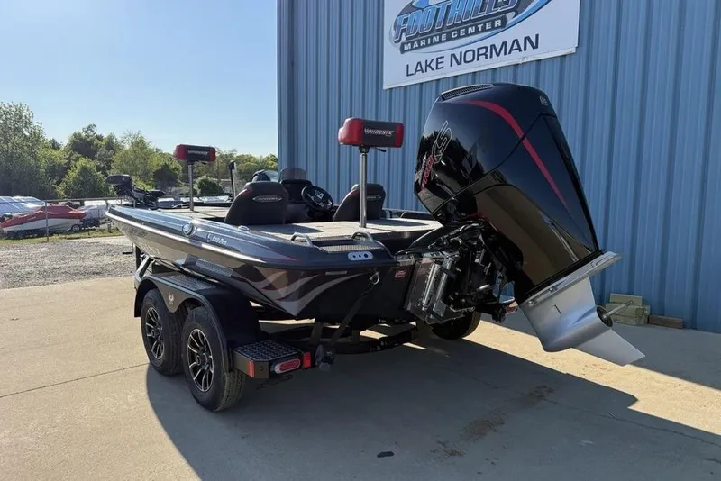 Slide: The Image of 2026 Phoenix 818 Pro boat with powerful engine at Lake Norman marine center. - 6