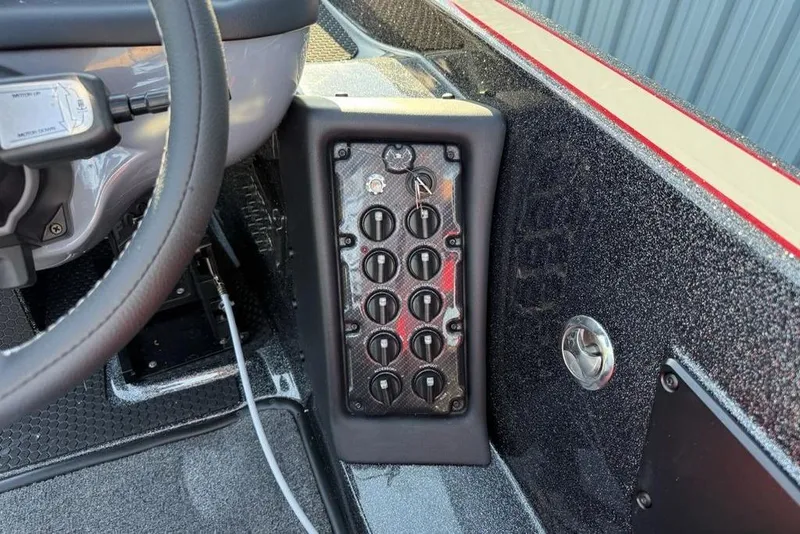 Slide: The Image of Dashboard of 2026 Phoenix 818 Pro boat with control panel and steering wheel. - 9