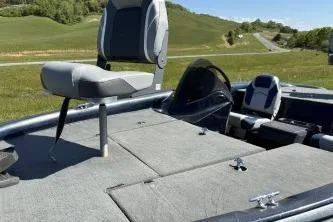 Slide: The Image of 2006 Stratos 275 Pro XL boat with seating, set in a scenic outdoor landscape. - 3