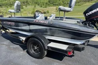 Slide: The Image of 2006 Stratos 275 Pro XL boat with Evinrude motor on trailer. - 4