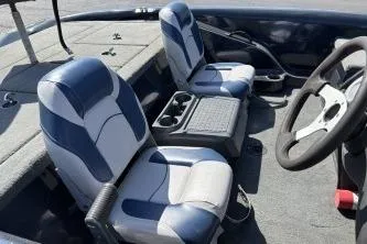 Slide: The Image of 2006 Stratos 275 Pro XL boat interior with dual seats and steering wheel. - 5