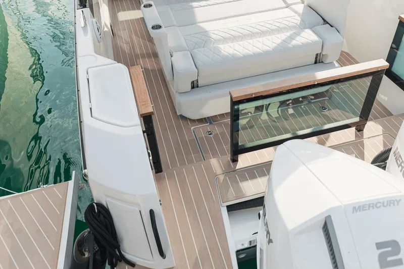 Slide: The Image of The image shows the deck of a 2027 Saxdor 270 GTO with sleek seating and wooden flooring. - 3