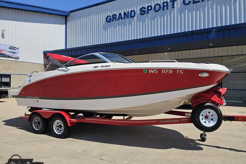 Slide: The Image of 2018 Four Winns HD220 boat on trailer outside Grand Sport Center. - 14