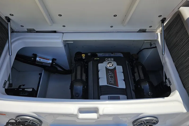 Slide: The Image of 2018 Four Winns HD220 boat engine compartment with 4.5L engine visible. - 44