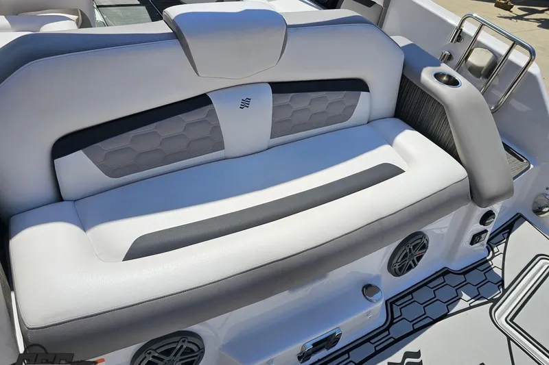 Slide: The Image of 2018 Four Winns HD220 boat interior with cushioned seating and cup holder. - 48