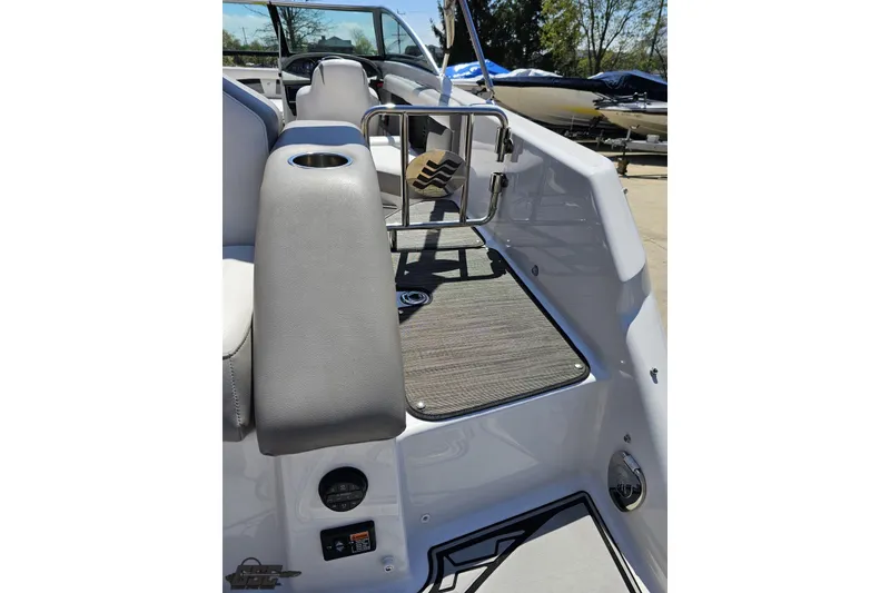 Slide: The Image of 2018 Four Winns HD220 boat interior with seating and cup holder. - 49