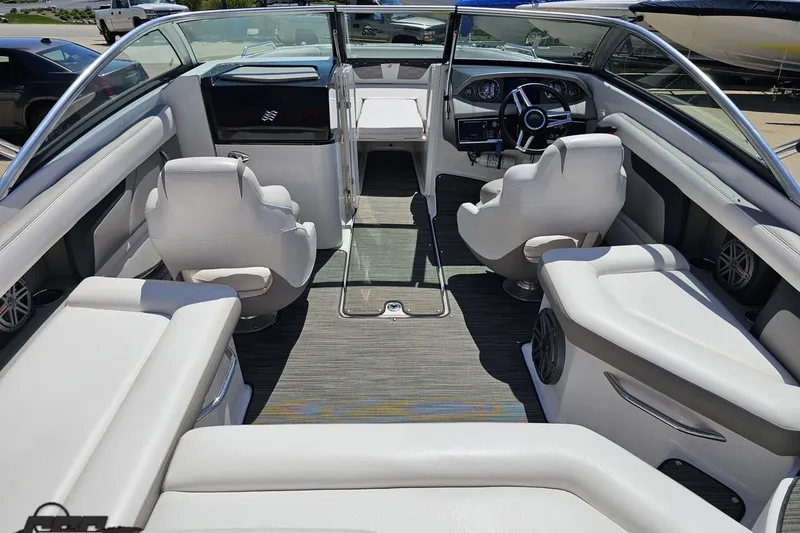 Slide: The Image of 2018 Four Winns HD220 boat interior with white seating and modern dashboard. - 54
