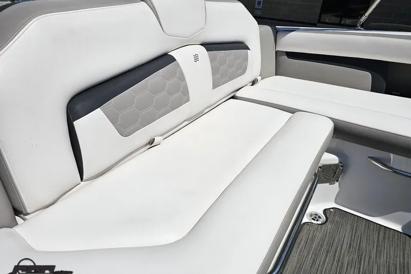Slide: The Image of 2018 Four Winns HD220 boat interior with white cushioned seating and modern design. - 57
