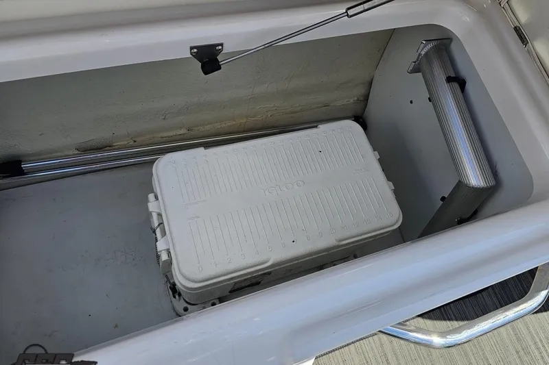 Slide: The Image of Storage compartment with cooler in 2018 Four Winns HD220 boat. - 60