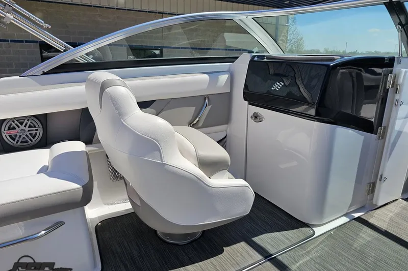 Slide: The Image of Interior of 2018 Four Winns HD220 boat with white seating and modern design. - 61
