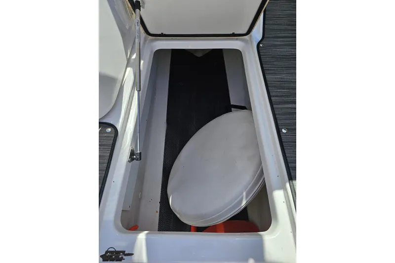 Slide: The Image of Storage compartment in 2018 Four Winns HD220 boat, featuring a hydraulic lift. - 65