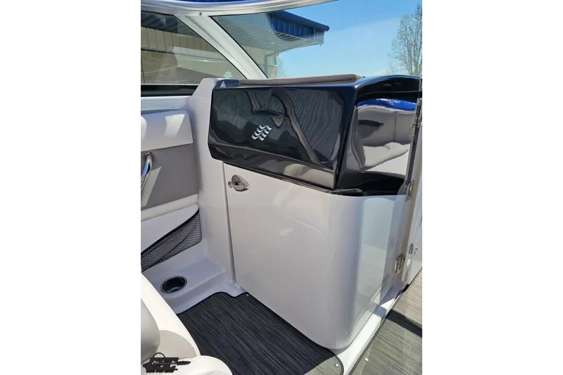 Slide: The Image of 2018 Four Winns HD220 boat interior with sleek black and white design. - 67
