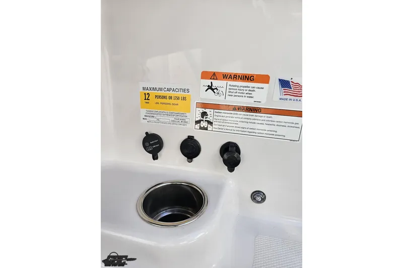 Slide: The Image of 2018 Four Winns HD220 boat capacity and safety warning labels with cup holder. - 77