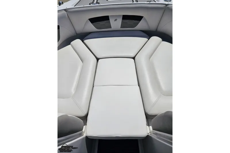 Slide: The Image of 2018 Four Winns HD220 boat interior with white cushioned seating. - 80