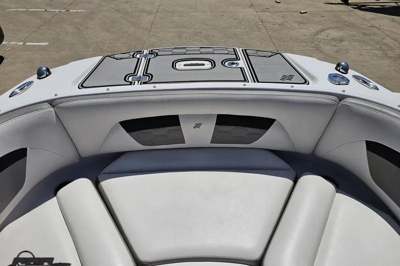 Slide: The Image of 2018 Four Winns HD220 boat interior with cushioned seating and sleek design. - 81