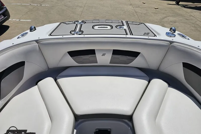 Slide: The Image of 2018 Four Winns HD220 boat interior with white cushioned seating and sleek design. - 84