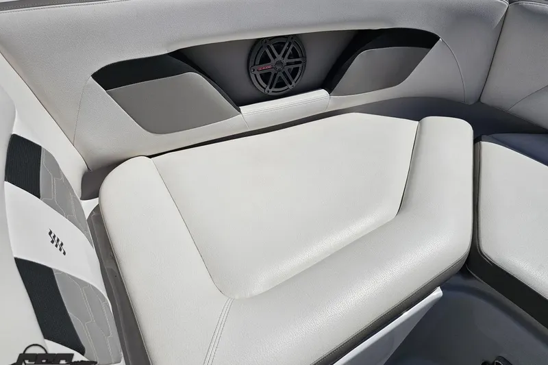 Slide: The Image of 2018 Four Winns HD220 boat interior with cushioned seating and integrated speaker system. - 86