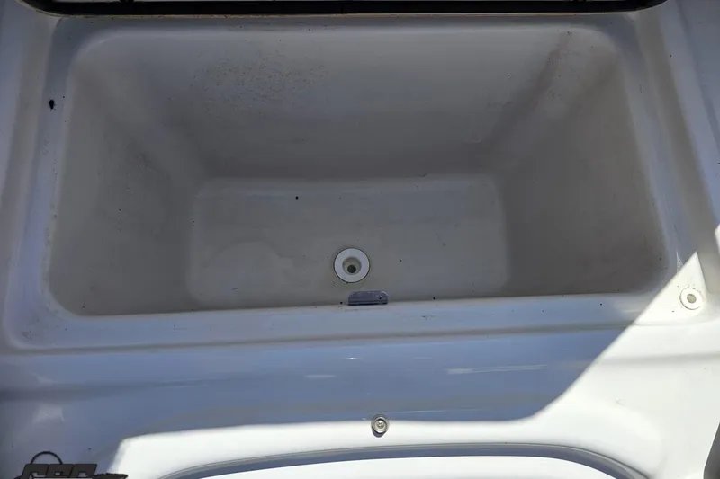 Slide: The Image of Storage compartment of 2018 Four Winns HD220 boat, featuring a clean, white interior. - 88