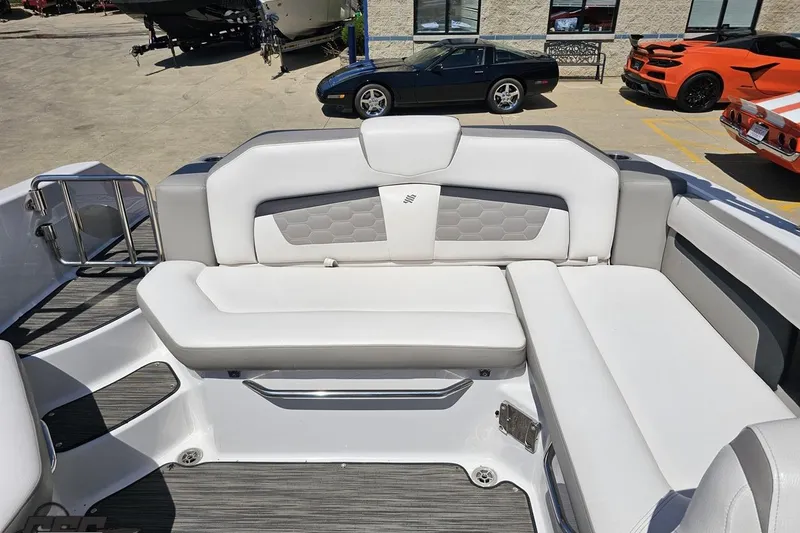 Slide: The Image of 2018 Four Winns HD220 boat interior with white seating and modern design. - 92
