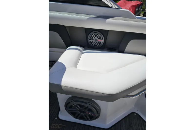 Slide: The Image of 2018 Four Winns HD220 boat interior with white seating and built-in speakers. - 97