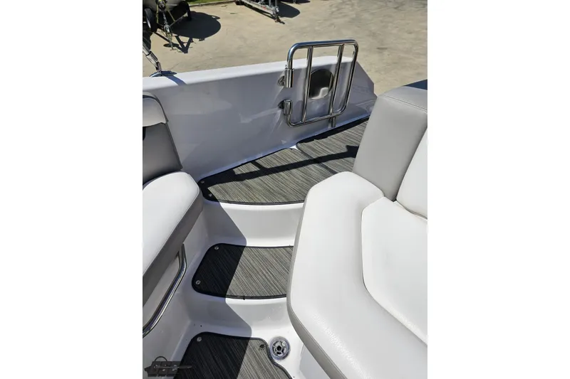 Slide: The Image of Interior view of 2018 Four Winns HD220 boat, featuring sleek seating and flooring. - 99