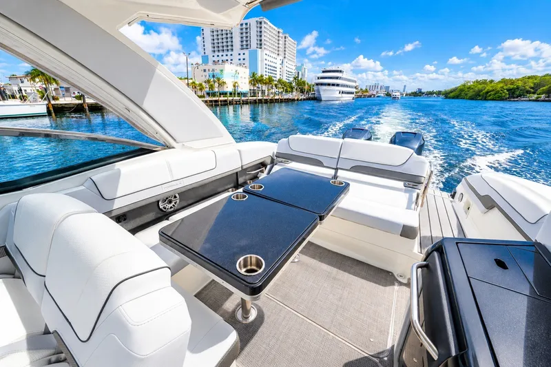 Slide: The Image of Luxurious 2022 Formula 310 Bowrider OB cruising on a sunny waterfront. - 8
