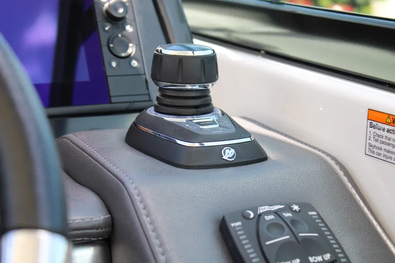 Slide: The Image of Control panel of 2022 Formula 310 Bowrider OB boat, featuring joystick and navigation controls. - 14