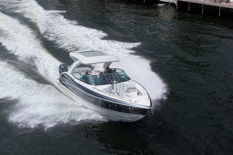 Slide: The Image of 2022 Formula 310 Bowrider OB cruising on water, showcasing sleek design and performance. - 31