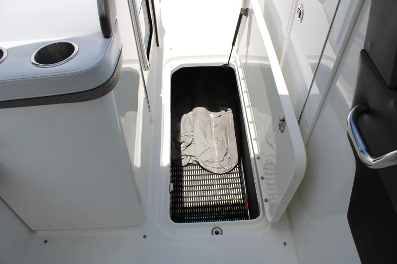 Slide: The Image of 2022 Formula 310 Bowrider OB storage compartment with open hatch and interior view. - 20