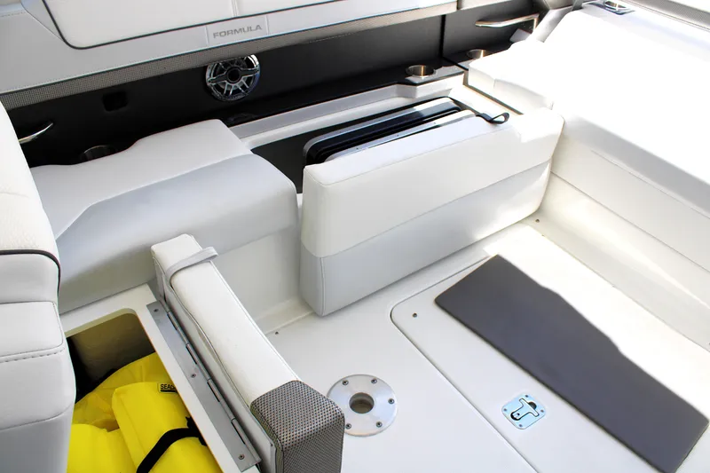Slide: The Image of 2022 Formula 310 Bowrider OB interior with white seating and storage compartments. - 21
