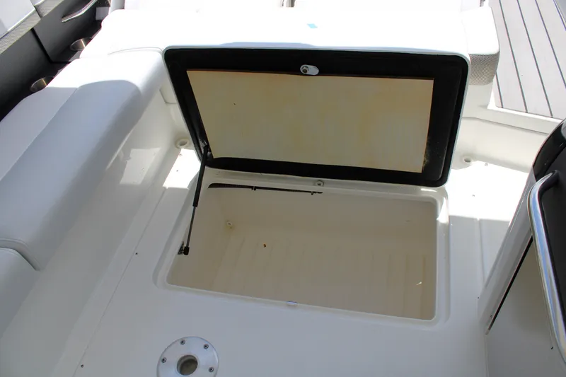 Slide: The Image of Open storage compartment on 2022 Formula 310 Bowrider OB boat. - 24