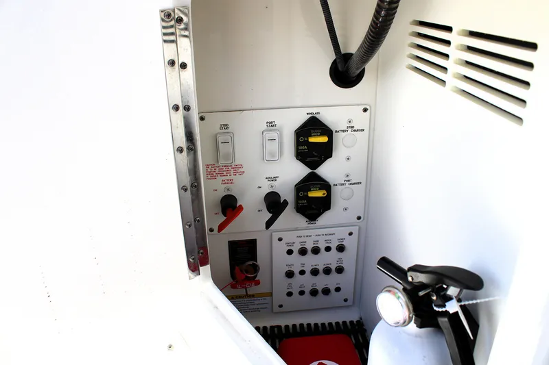 Slide: The Image of Control panel of a 2022 Formula 310 Bowrider OB boat, featuring switches and gauges. - 28