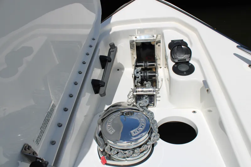 Slide: The Image of 2022 Formula 310 Bowrider OB anchor compartment with winch and chain. - 32