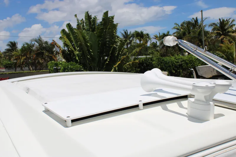 Slide: The Image of 2022 Formula 310 Bowrider OB boat roof with horn, tropical background. - 34