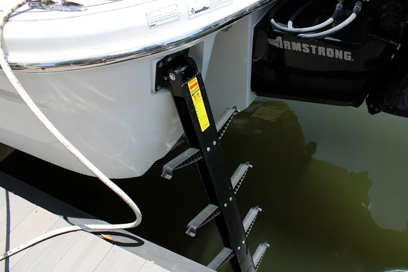 Slide: The Image of 2022 Formula 310 Bowrider OB with ladder and Armstrong bracket in water. - 35