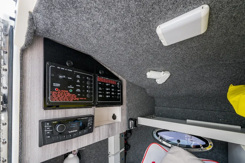 Slide: The Image of Interior view of 2022 Formula 310 Bowrider OB showing control panels and audio system. - 72