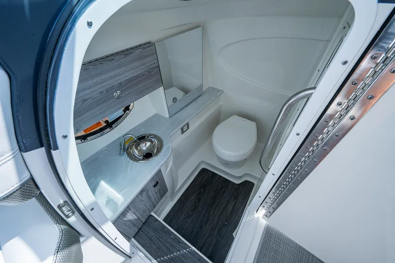 Slide: The Image of 2022 Formula 310 Bowrider OB boat bathroom with modern sink and toilet. - 37